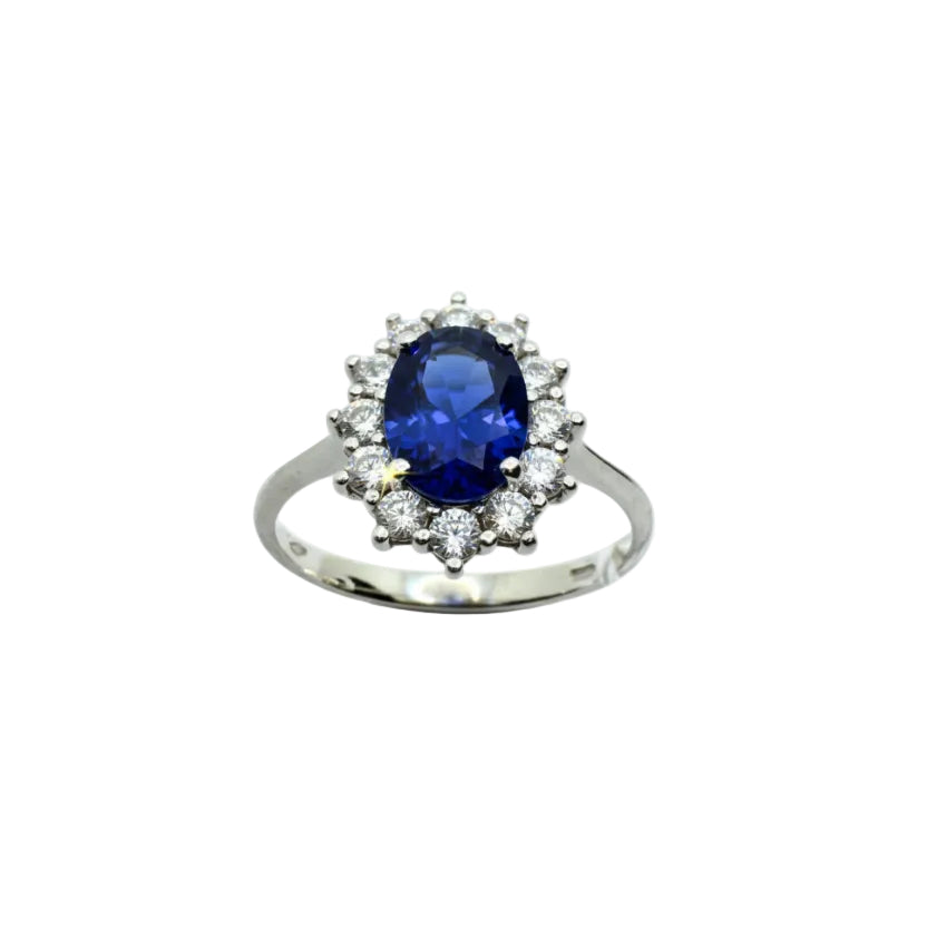 Anello Royal Ring in Oro Bianco 18 KT con Zircone Blu Taglio Ovale e Contorno di Zirconi Bianchi AN051