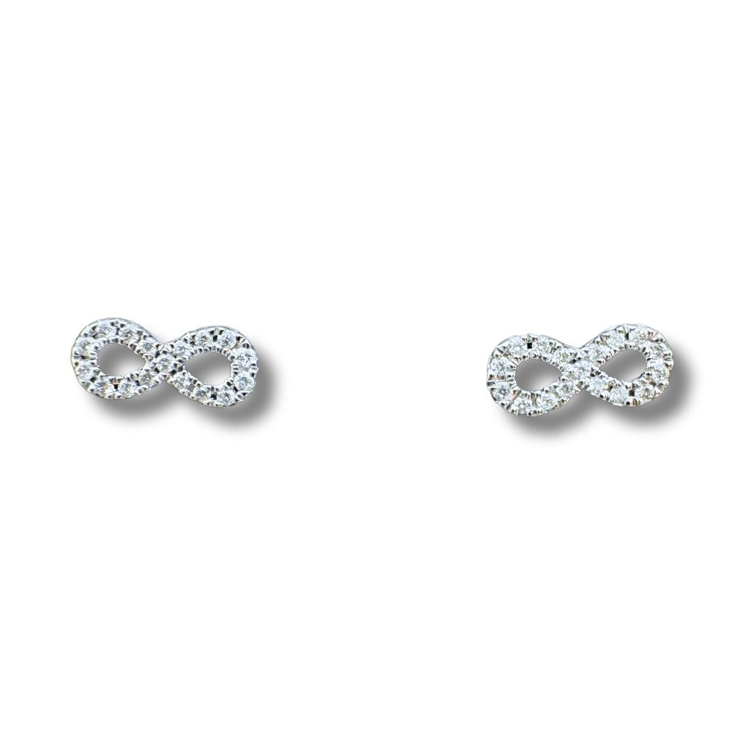 Pendientes Iannelli hechos a mano con el símbolo del infinito en oro y diamantes.
